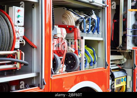 Side view of firetruck with equipment for rescue operations. Katy Wroclawskie, Poland - May 28, 2022 Stock Photo