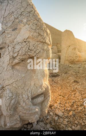 Antique statues at sunrise on Nemrut mountain in Turkey. Stock Photo
