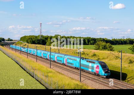 A TGV Duplex high speed train from french rail company SNCF is driving from  Paris on the LGV Sud-Est in the countryside Stock Photo - Alamy