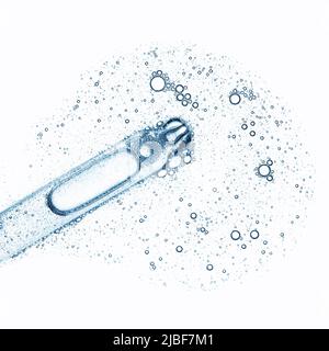 Blue serum liquid in cosmetic dropper pipette with bubbles isolated on white background top view Stock Photo