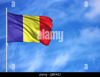 National flag of Romania on a flagpole Stock Photo