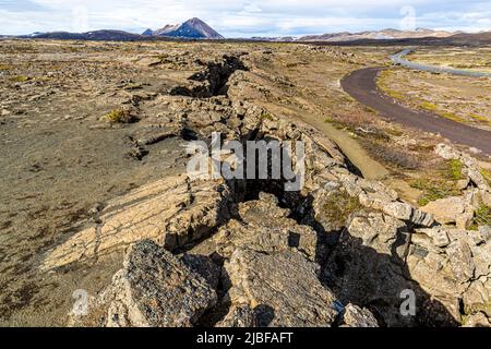 Grjótagjá (engl.: 'crevice') is a cave with a small lake in Iceland. Above ground, the fault zone between the continental plates is visible Stock Photo