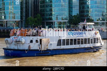 Sightseeing boat tour on River Thames, City Cruises by Hornblower, London, England, UK Stock Photo
