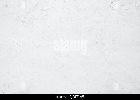 Empty white building wall texture background. Rough surface and cracked white cement wall. White wall texture abstract background. Concrete surface. Stock Photo