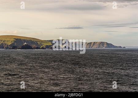 The lighthouse at Muckle Flugga is situated on the most northerly rock in the Shetland Isles Stock Photo