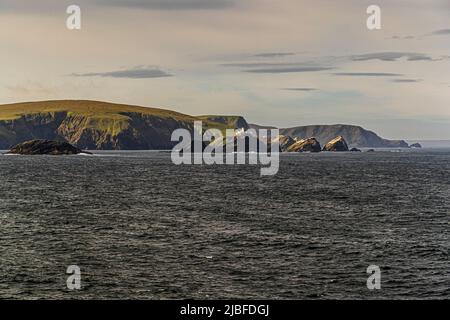 The lighthouse at Muckle Flugga is situated on the most northerly rock in the Shetland Isles Stock Photo