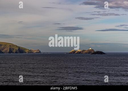 The lighthouse at Muckle Flugga is situated on the most northerly rock in the Shetland Isles Stock Photo