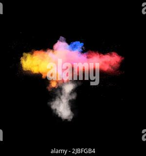 Various multicolored forms of powder paint explode in front of a black background giving off fantastic  exploding clouds of vivid colored powder paint Stock Photo