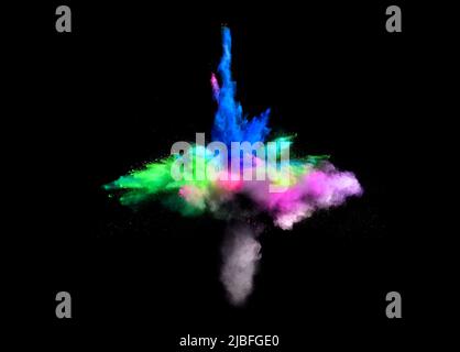 Various multicolored forms of powder paint explode in front of a black ...