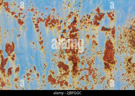 Rusty metal surface with blue cracked paint. Old rusty metal. Metal covered with rust Stock Photo