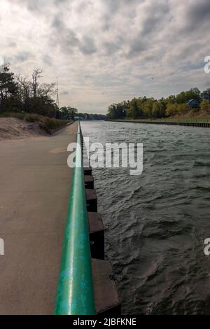 Pentwater, MI - May 20, 2022: Boardwalk on the canal leading to the small town Stock Photo