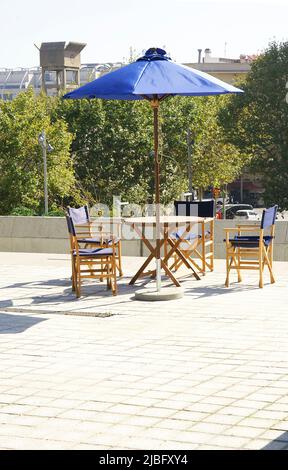 Tables and chairs on the esplanade of the Museu del Disseny in Barcelona, Catalunya, Spain, Europe Stock Photo