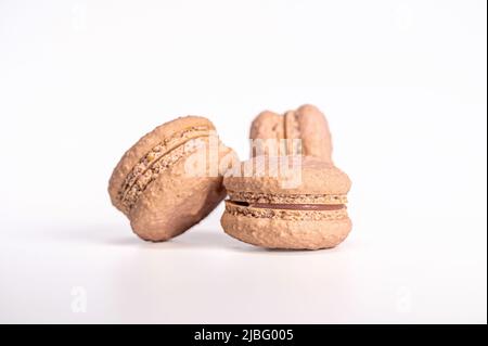 macarons, confectionery sweet product, three pink macarons isolated on white background Stock Photo