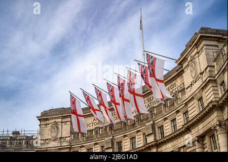 LONDON - May 18, 2022: White Ensign flags hanging from Admiralty Arch in London, for the Platinum Jubilee Celebrations Stock Photo