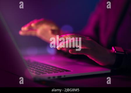 Female manager is using laptop. Computer and hands close up. Stock Photo