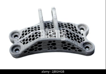 Model printed on a 3d printer made of cement concrete isolated on a white background close-up. Additive automation manufacturing 3D printing technology. Concept new modern 3d printing technologies. Stock Photo