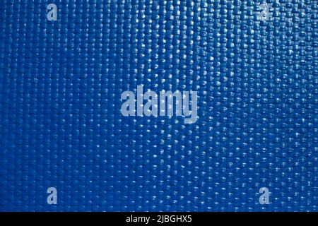 Blue texture. Fine texture of surface of painted board. Lots of points. Glare on board. Stock Photo