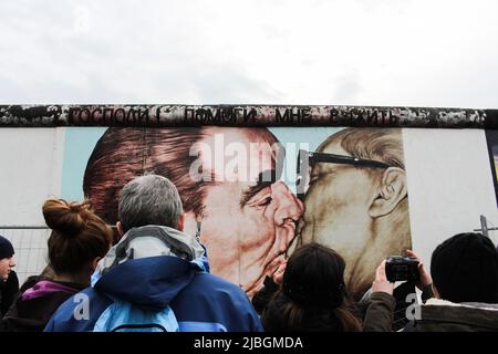Iconic art (Leonid Brezhnev & Erich Honecker’s kiss) by Dmitri Vrubel, on Berlin wall. Translation : My God, Help Me to Survive This Deadly Love