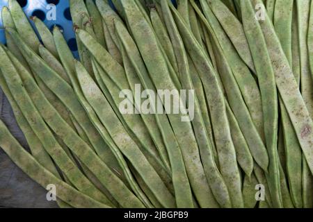 Fresh green or string beans in a tray in the supermarket. Green string beans. Top view Stock Photo