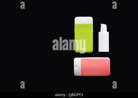 Flat lay spa composition with skin care products on black background. Stock Photo