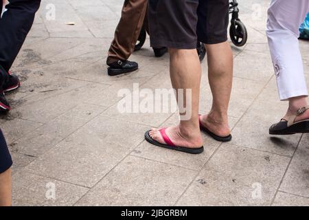 Steps Out in Strappy Thong Sandals With a Scarf Top & Matching Power Suit  for Dinner