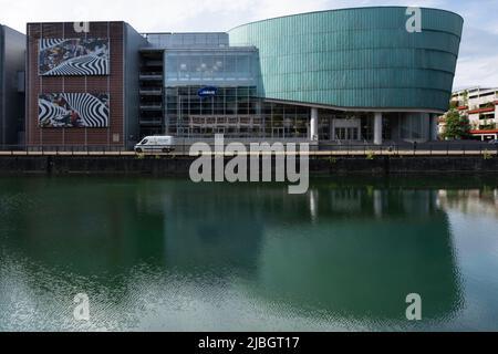 'UGC Cine Cite Strasbourg' cinema building in Strasbourg on Presqu'ile Malraux. Reflected in the water Stock Photo