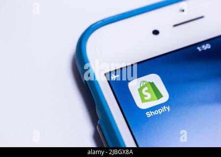 Shopify app on an iPhone. Shopify Inc. is a Canadian multinational e-commerce (for online stores & retail point-of-sale systems) company Stock Photo