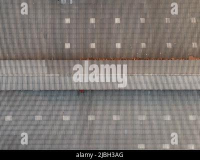 Aerial view of industrial factory roof with ventilation stacks and HVAC ...