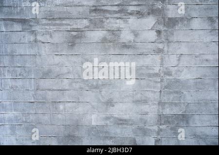 Texture of grey stained cement brick block wall background Stock Photo