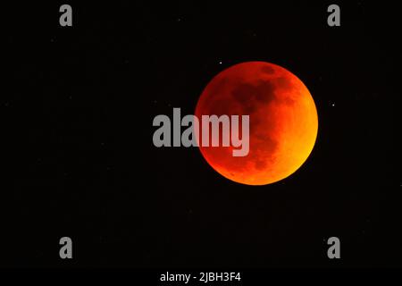 Red moon during total Lunar Eclipse in May 2022 Stock Photo