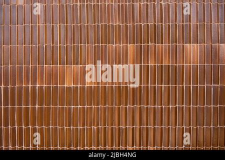 Exterior of brown wall clay tile of tropical house texture background Stock Photo