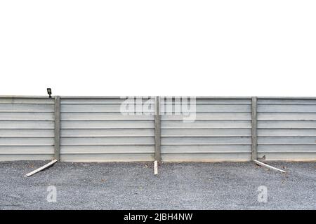 Cement wall with channel parking lot on gravel on white empty background Stock Photo