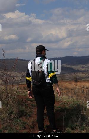 A person looking into the distance in the valley of the extinct volcano in Racos Stock Photo