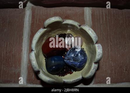 Bowl in which crystals and semi-precious stones are various Stock Photo