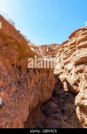 Red rocks and a passage between rocks. Clay canyons. Issyk-Kul region ...