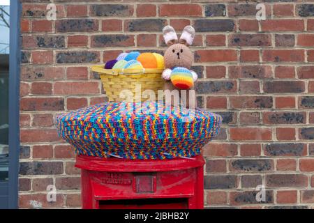 knitted Easter Bunny with eggs post box topper Stock Photo
