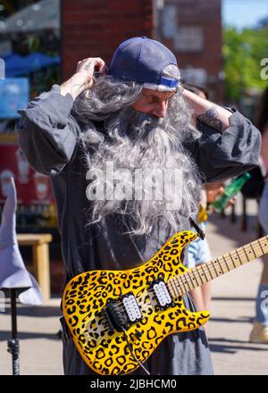 A man in stage clothes performs in Dundas St. West during the Do West Festival. Stock Photo