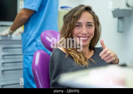 Female patient smiling in the dental clinic Stock Photo