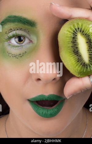 Kiwi woman fantasy makeup portrait Stock Photo