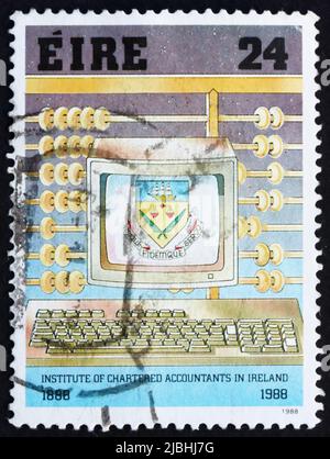 IRELAND - CIRCA 1988: a stamp printed in the Ireland shows Abacus and Personal Computer, Centenary of Institute of Chartered Accountants, circa 1988 Stock Photo