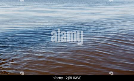 Lightly wavy texture of the water surface of the lagoon Stock Photo