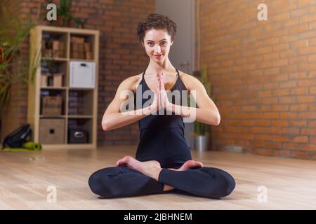 Premium Vector | A full girl is sitting in the lotus position on a  background of tropical leaves an overweight woman