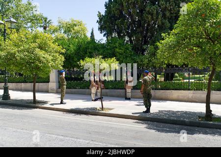 Presidential Guard soldiers Evzones or Evzonoi in the city center of the Greek capital - concept history tradition ceremony elite military. Stock Photo