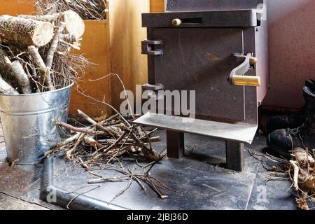 Typical wood burning stove in a Department of Conservation hut, Aotearoa / New Zealand Stock Photo