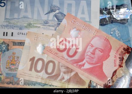 Toronto, Canada - October 30. 2021: One hundred and fifty Canadian Dollar banknotes. Canadian Money cash Stock Photo