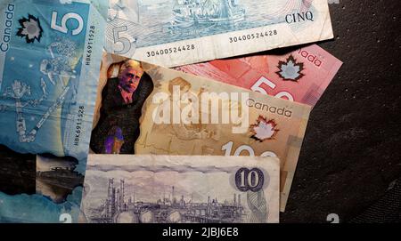 Toronto, Canada - October 30. 2021: Different canadian dollar banknotes, different epoch of CAD banknotes Stock Photo