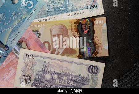 Toronto, Canada - October 30. 2021: Canadian Dollar bills different designs of Canadian Money, beautiful banknotes of Canada Stock Photo