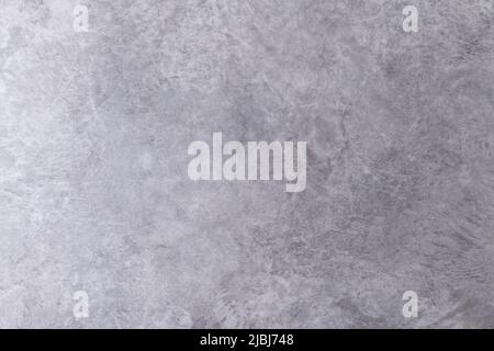 The texture of the stone wall.Small cracks on the concrete wall. Stock Photo