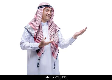 Arab man wearing keffiyeh showing something on his hand isolated over white background Stock Photo