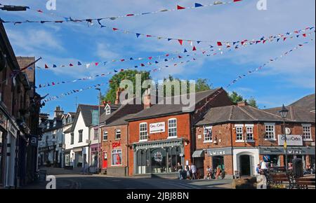 The Cross, square at the centre of Lymm village , Warrington, Cheshire, England, UK, WA13 0HU - shops, retail, restaurants Stock Photo